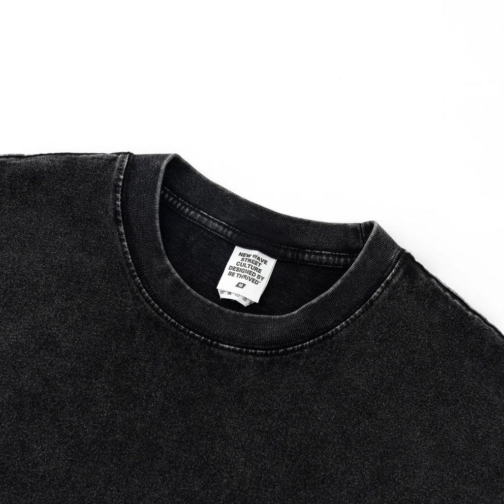 Black t-shirt with a visible brand label on a white background