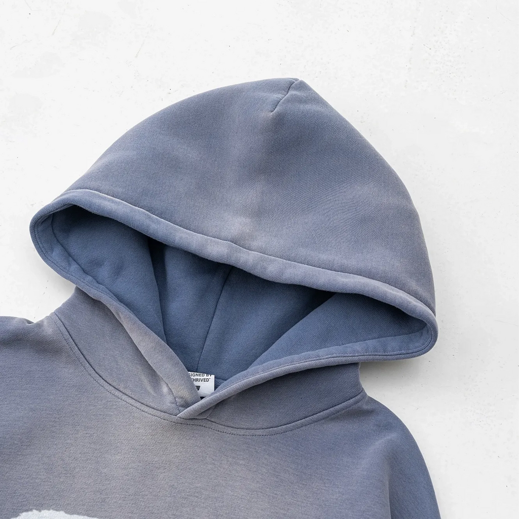 Blue hoodie with a white background