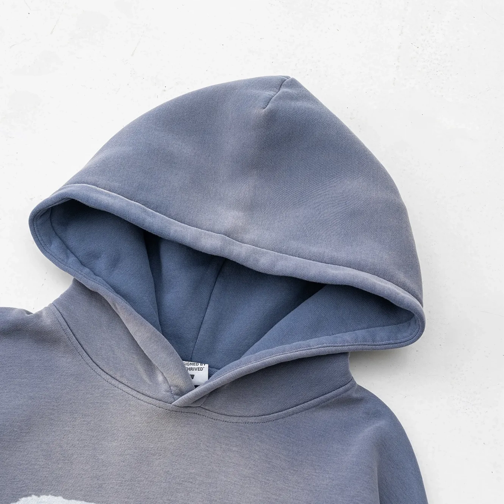 Blue hoodie with a white background