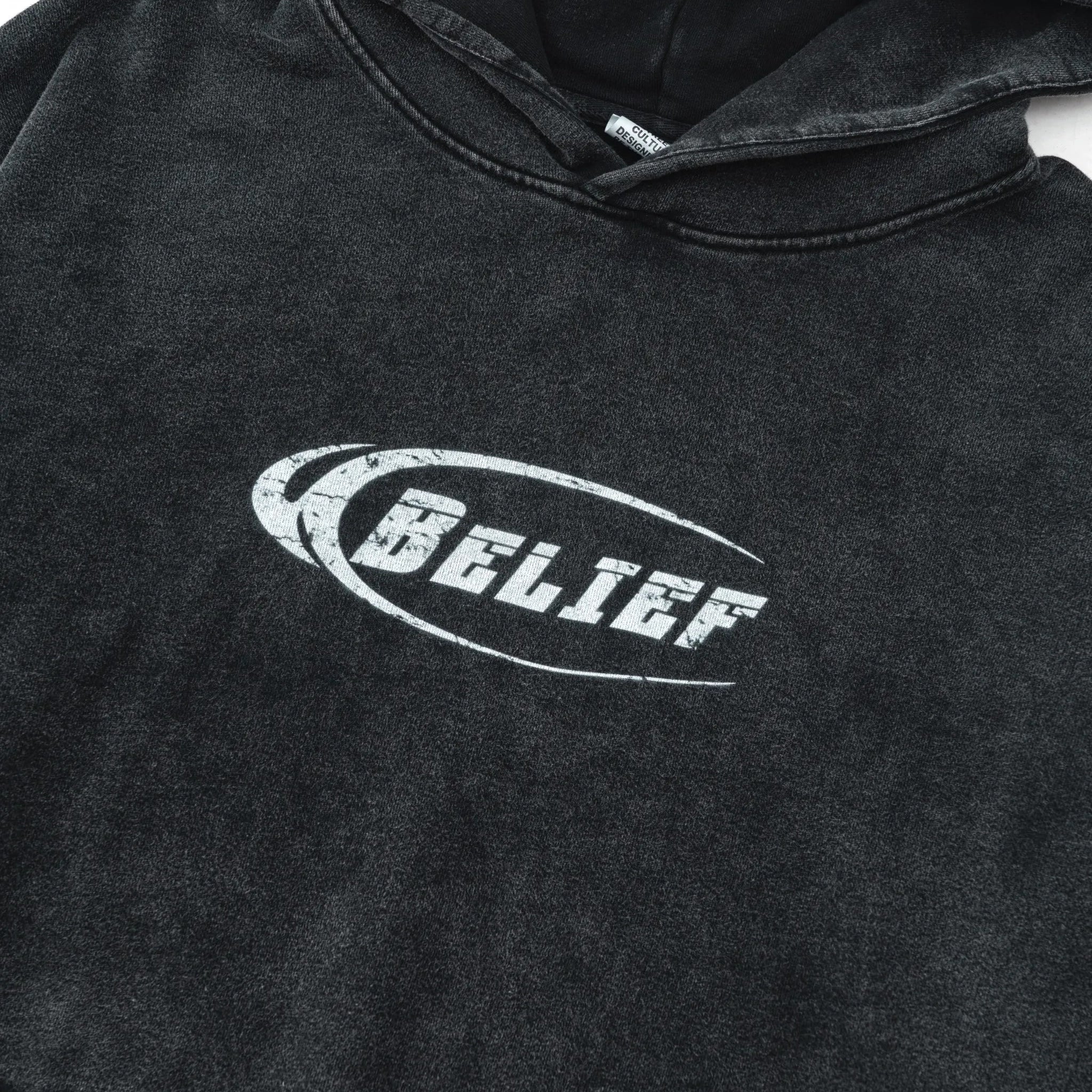 Black hoodie with 'BELIEF' logo on a white background