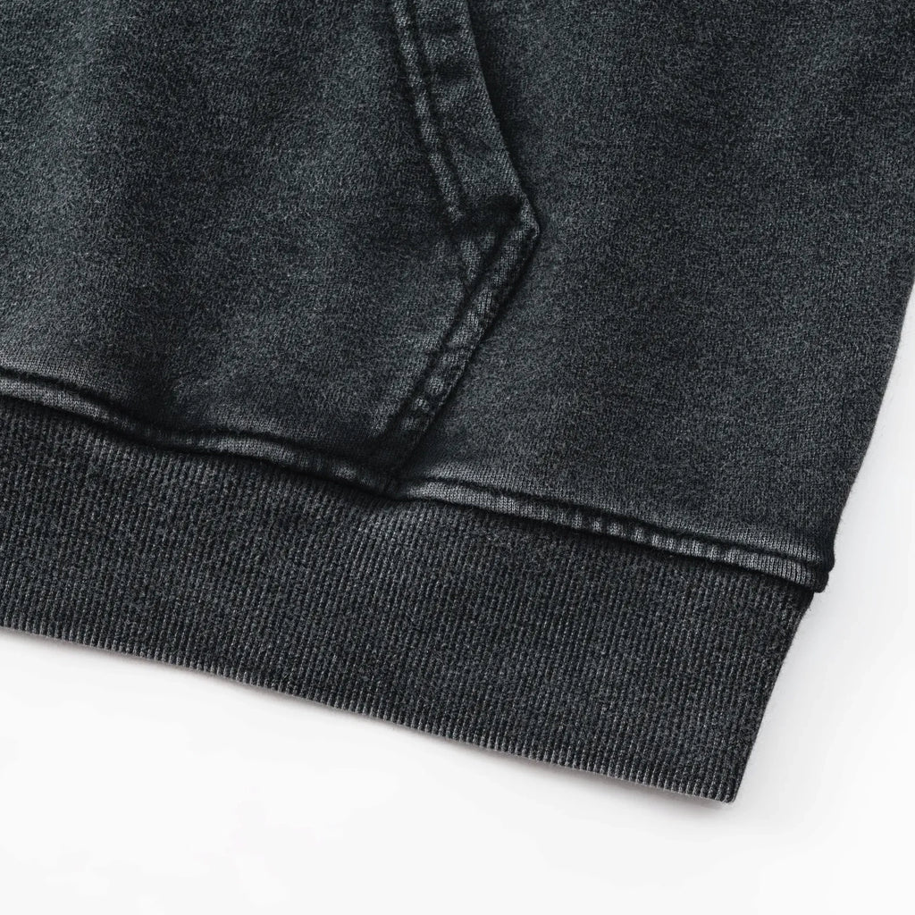 Close-up of a dark gray sweatshirt on a white background