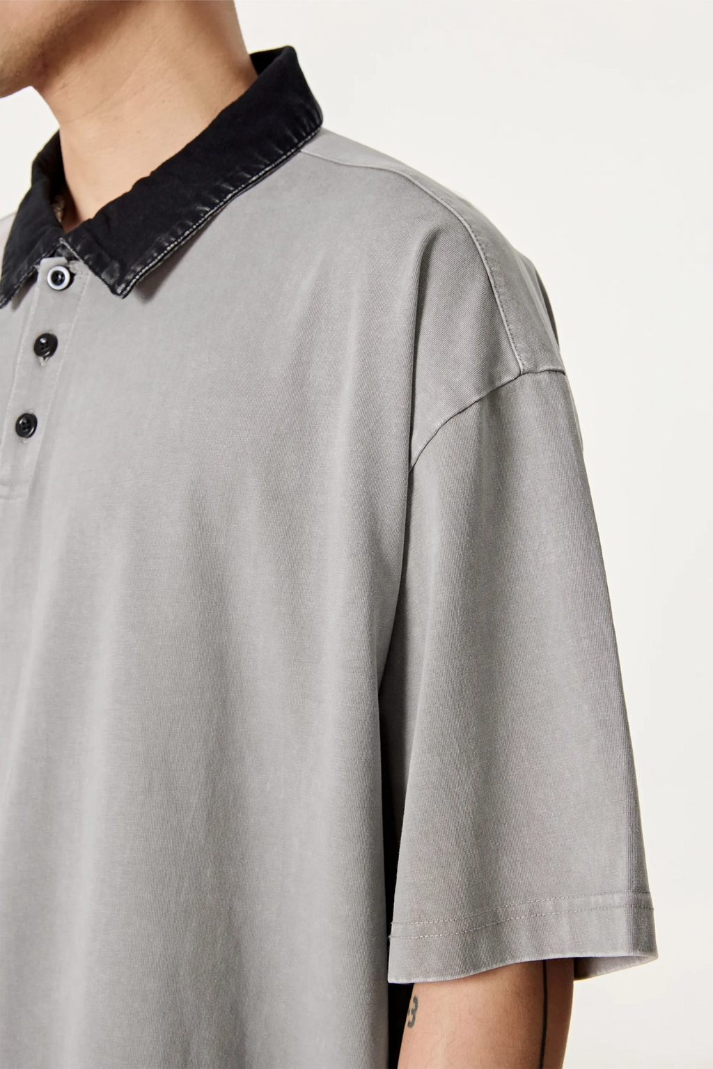 Gray shirt with black collar on a white background