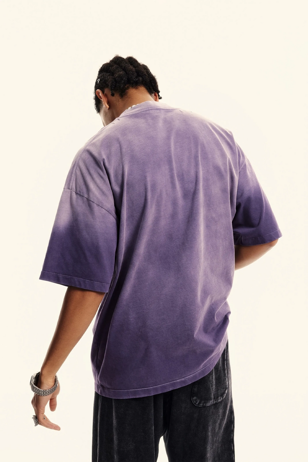Person wearing a purple t-shirt with a white background