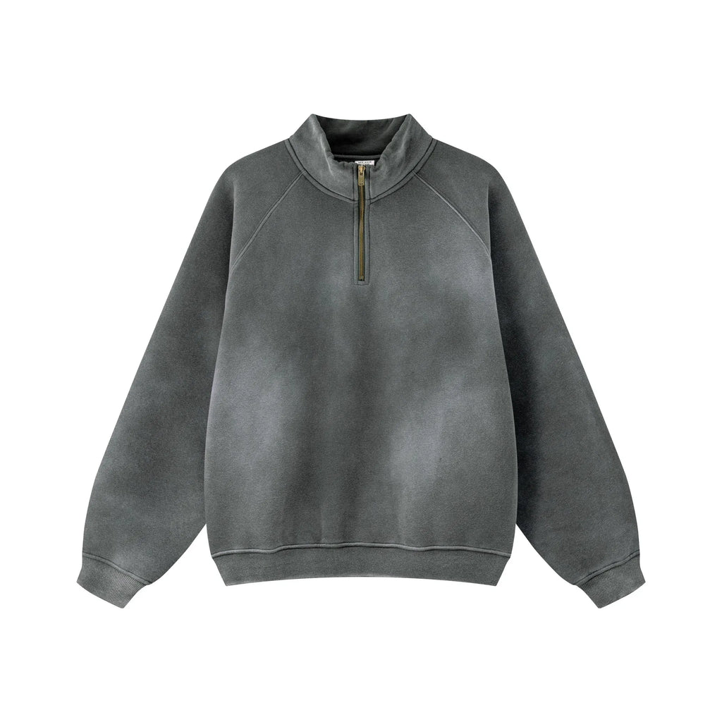 Gray sweatshirt with a quarter zip on a white background