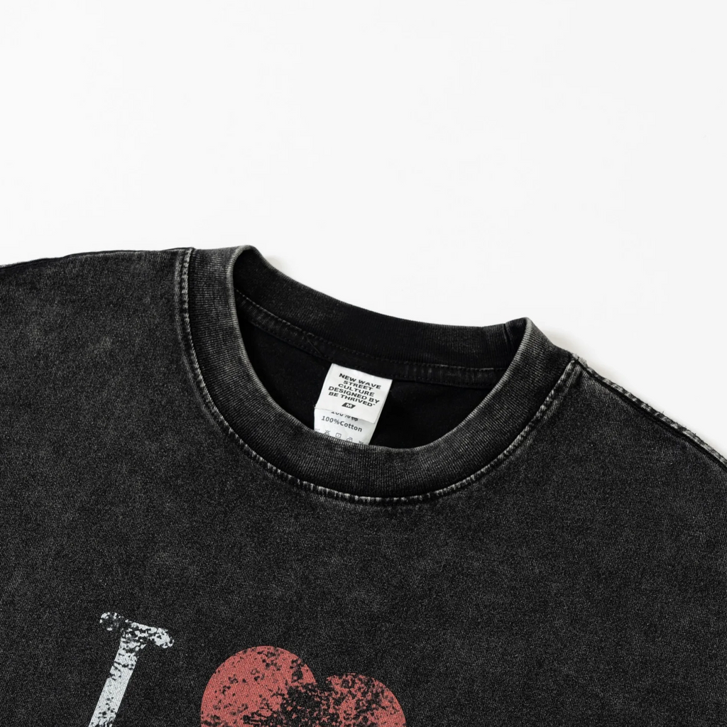 Black t-shirt with red and white graphic design on a white background