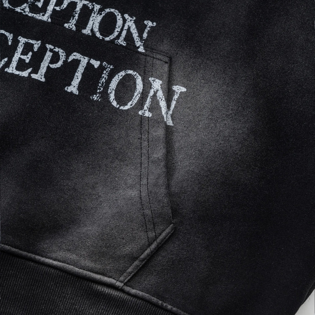 Black hoodie with 'DECEPTION' text on a dark background