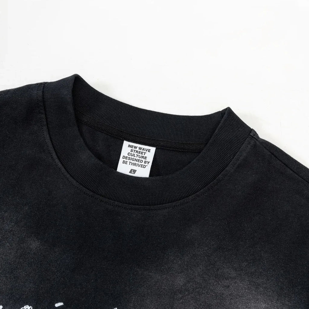 Black t-shirt with a visible brand label on a white background