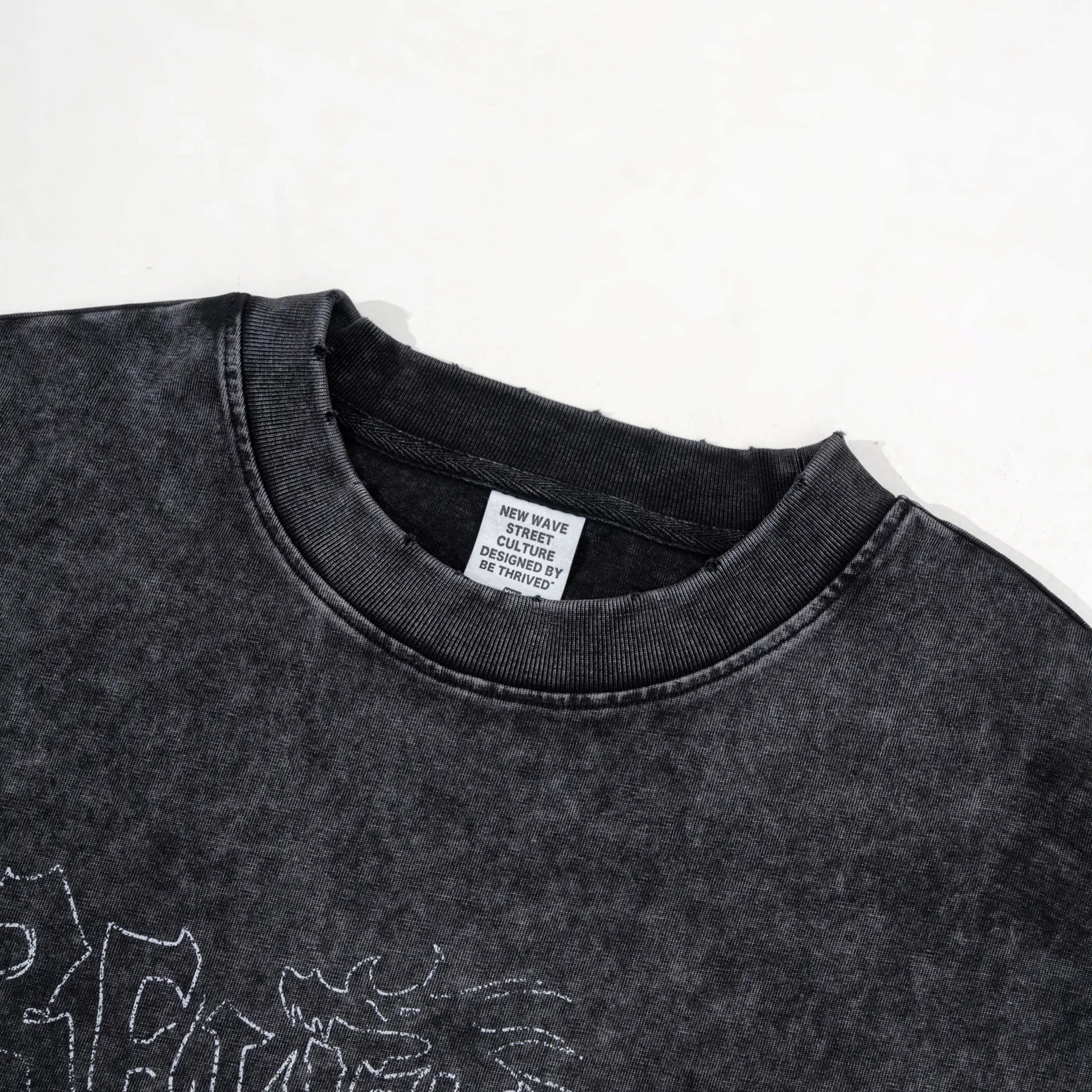 Black sweatshirt with a brand label on a white background