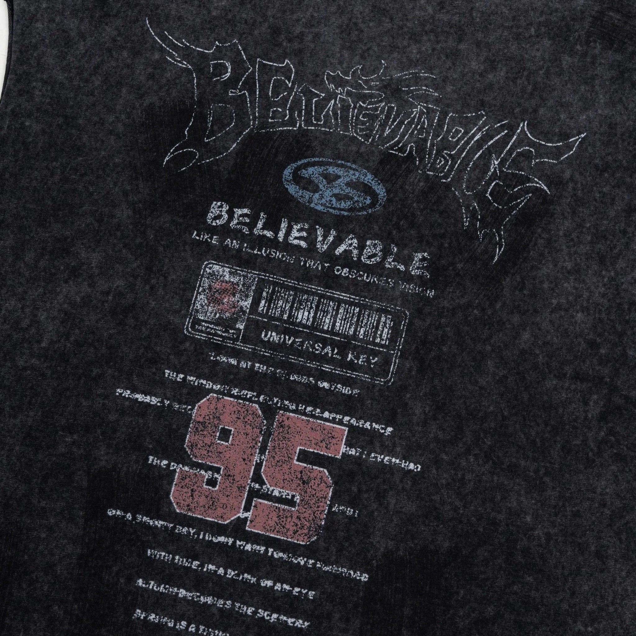 Black t-shirt with text and graphics on a dark background