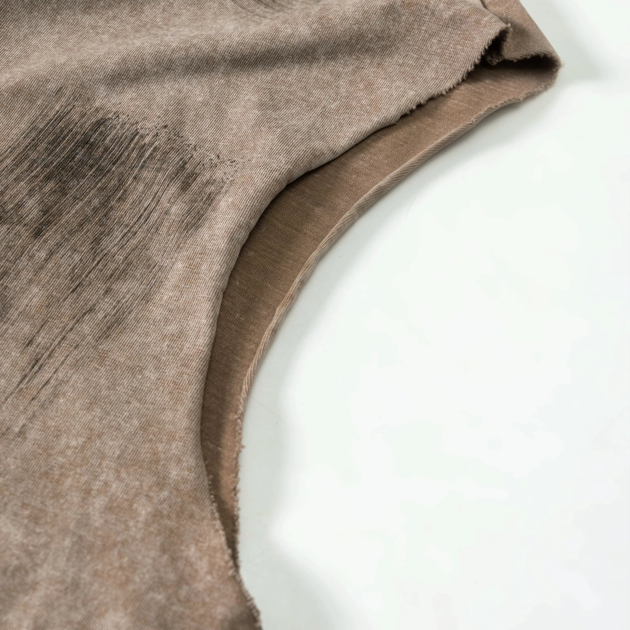 Close-up of brown fabric on a white background