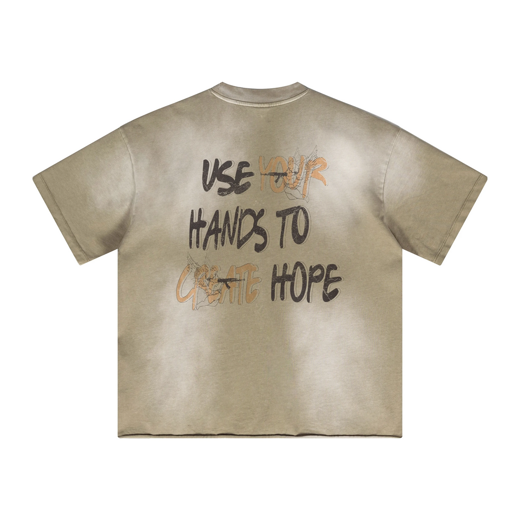 Beige t-shirt with motivational text on the back against a white background