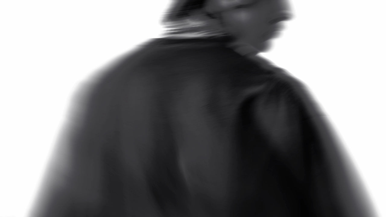 Black and white silhouette of a person wearing a coat and hat.