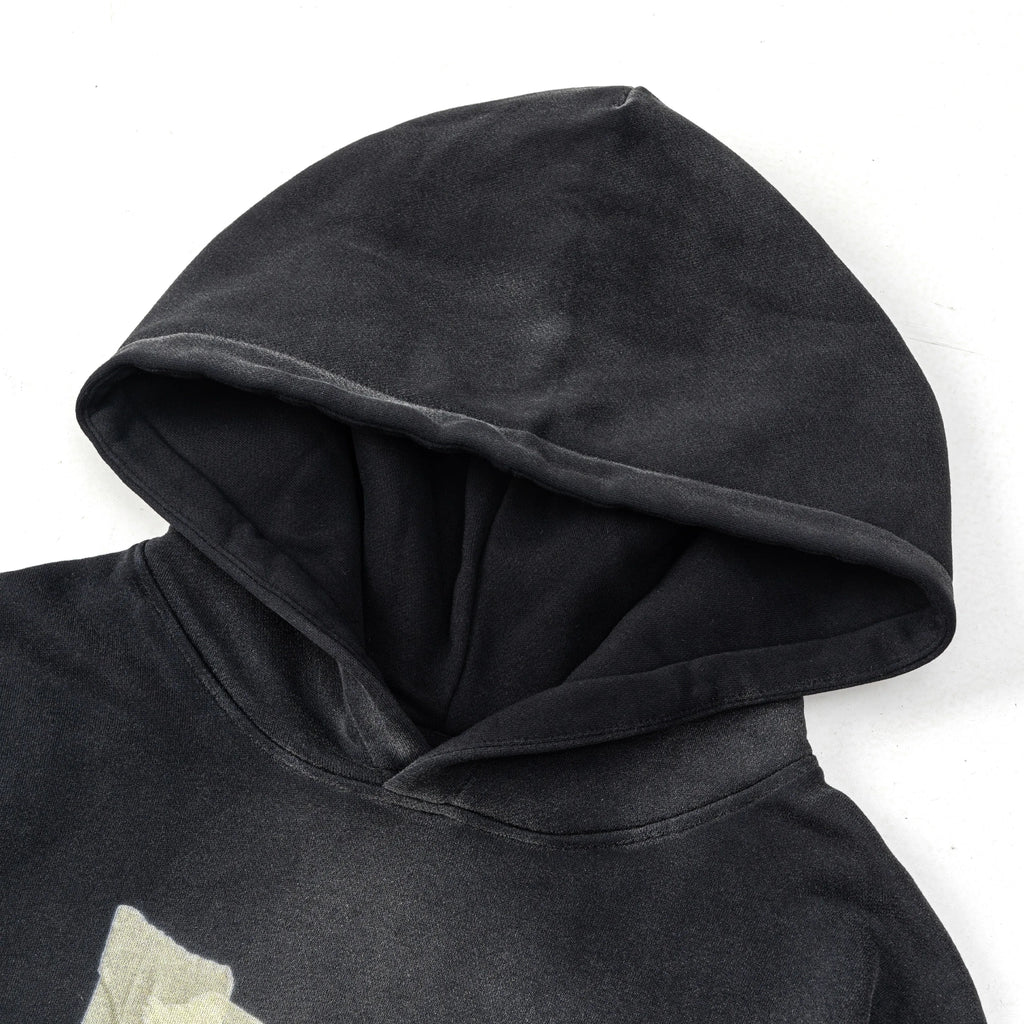 Black hoodie with a hood on a white background