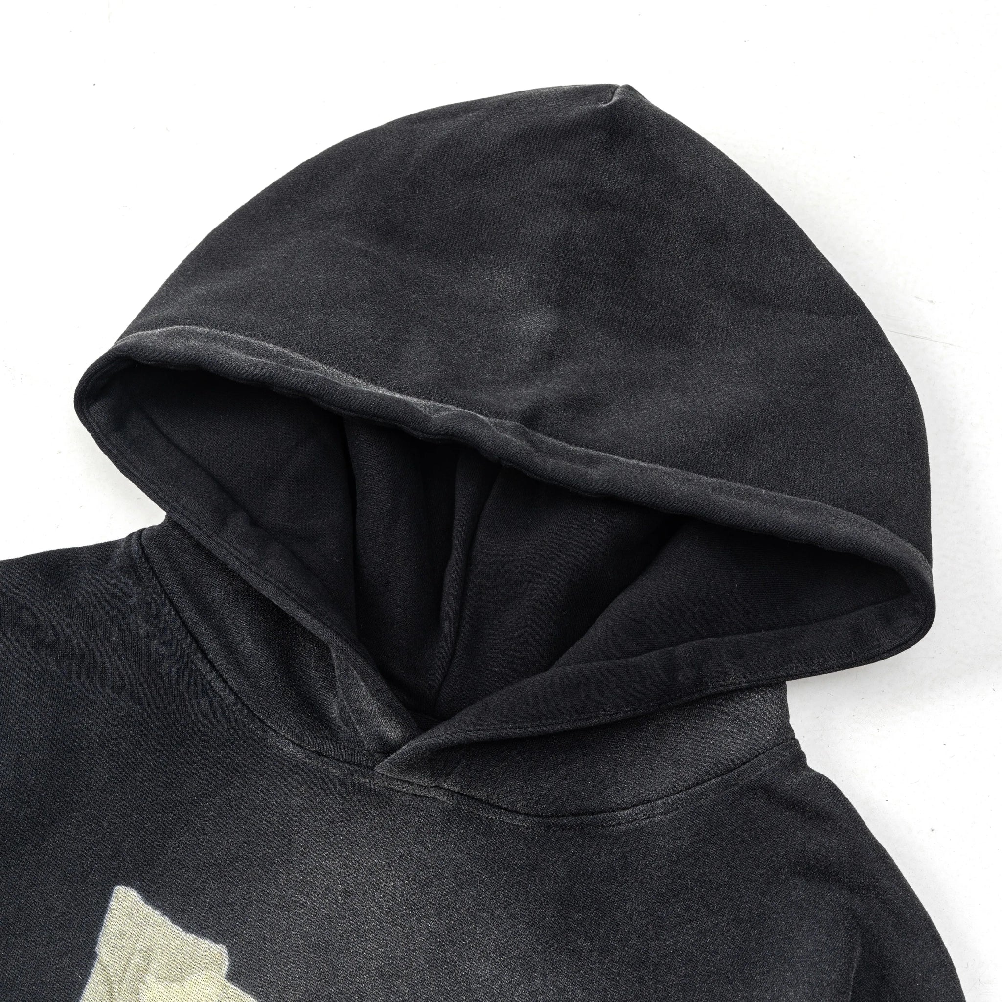 Black hoodie with a hood on a white background
