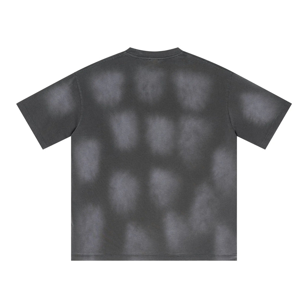 Black t-shirt with a unique pattern on a white background