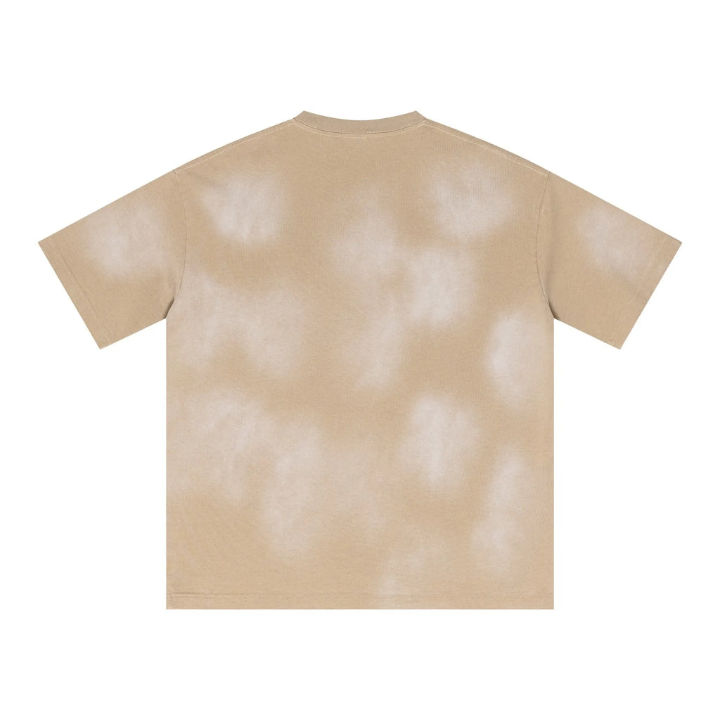Beige t-shirt with a tie-dye pattern on a white background