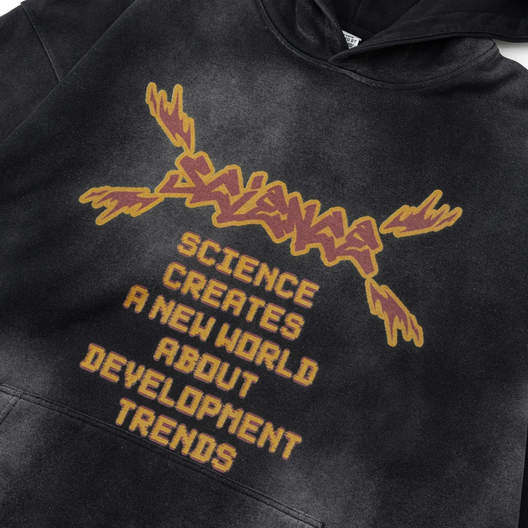 Black hoodie with yellow text and design on a white background