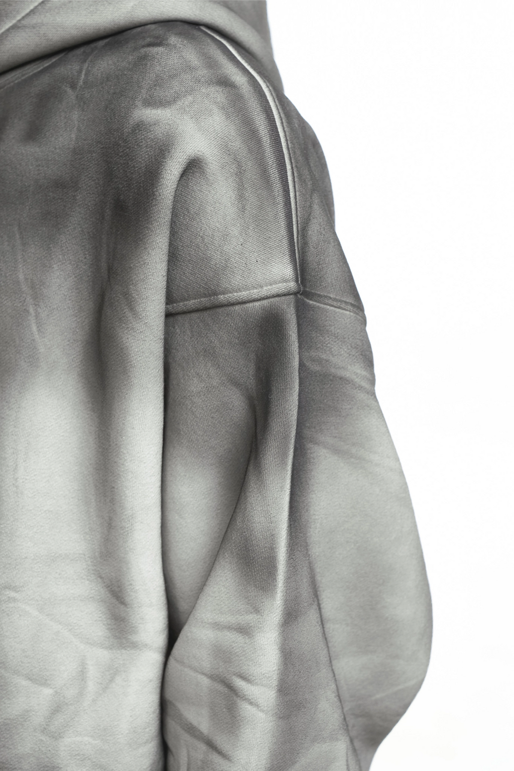 Close-up of a gray leather jacket on a white background