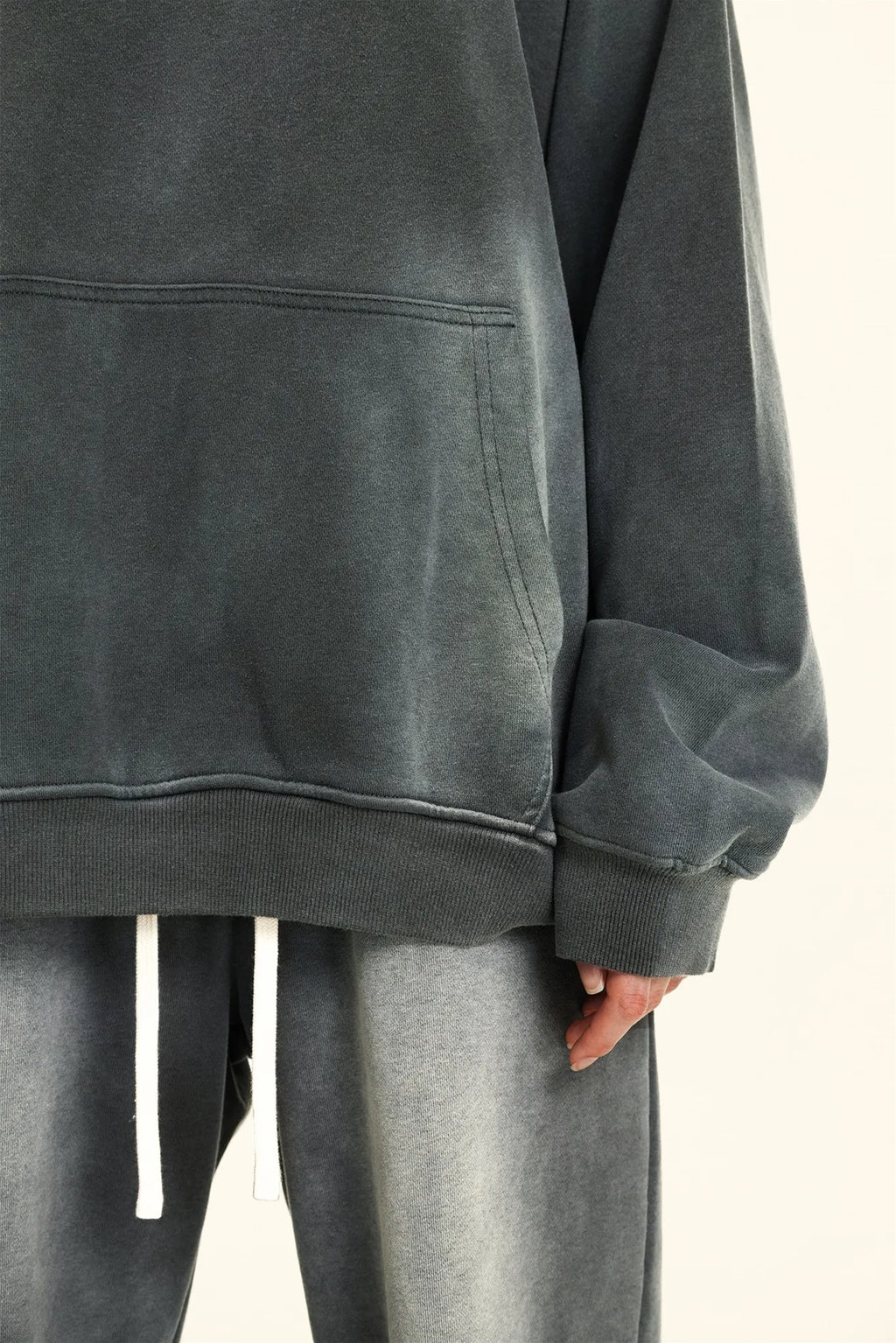 Gray oversized hoodie and pants on a neutral background