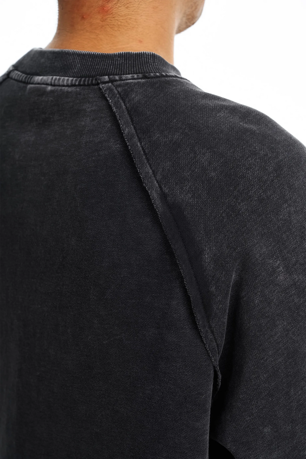 Black sweater with a collar detail on a white background