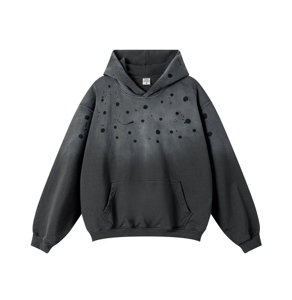 Black hoodie with speckled design on a white background