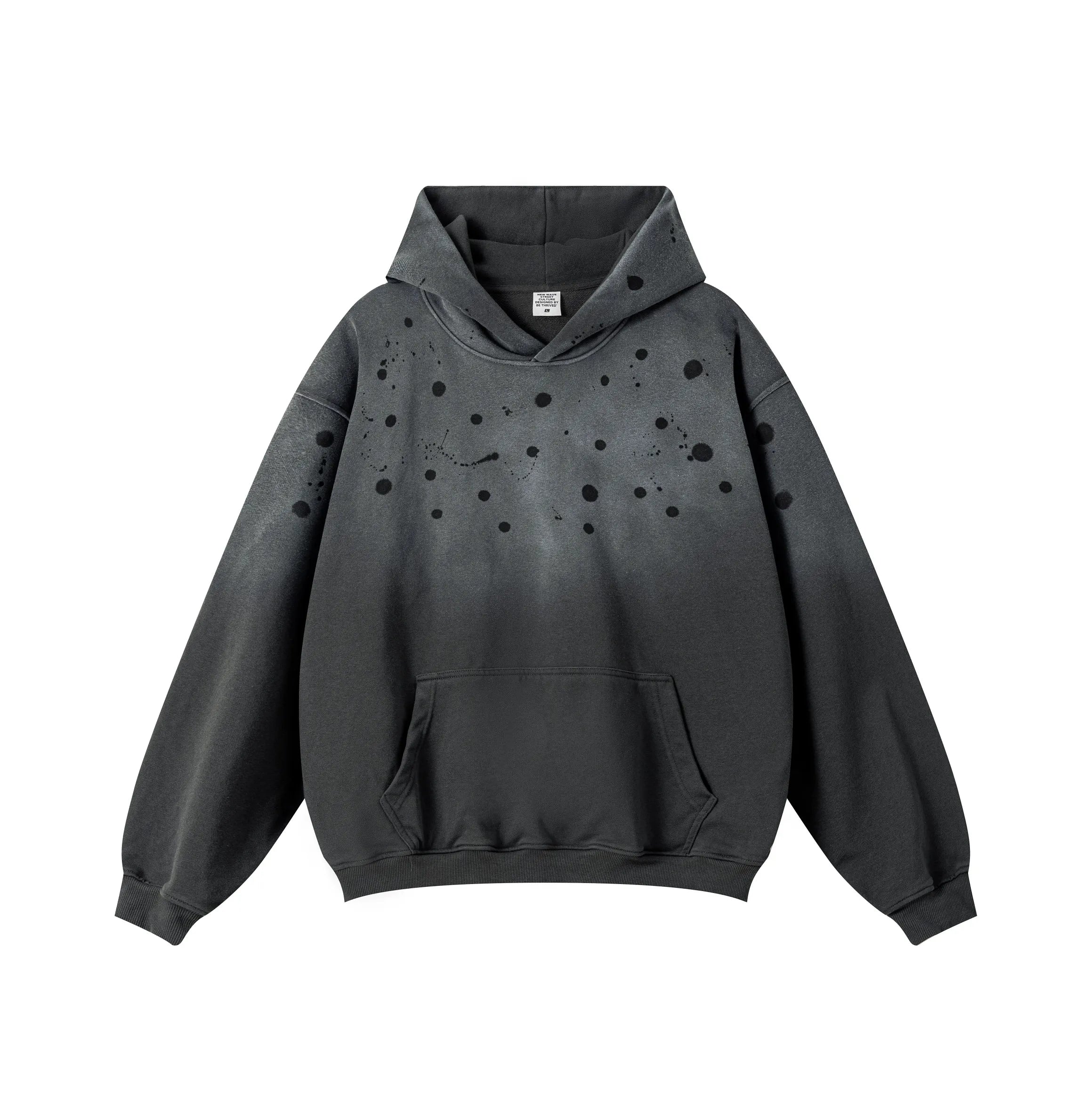 Black hoodie with speckled design on a white background