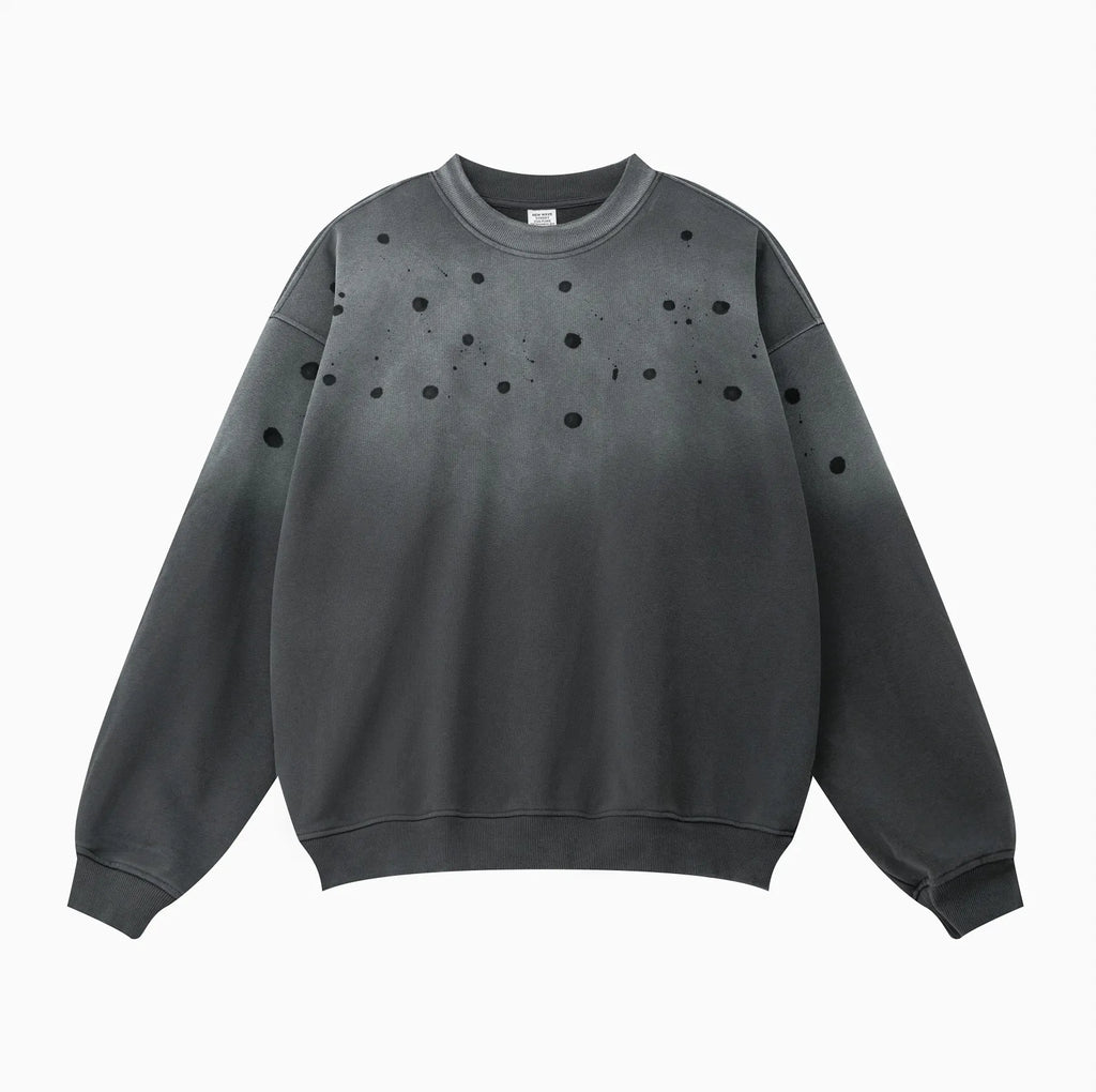 Gray sweatshirt with black dot pattern on a white background