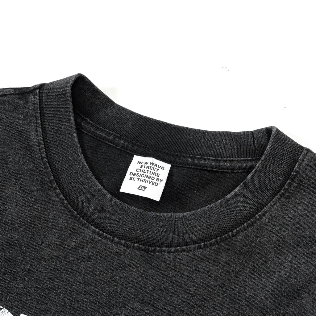 Black t-shirt with a brand label on a white background