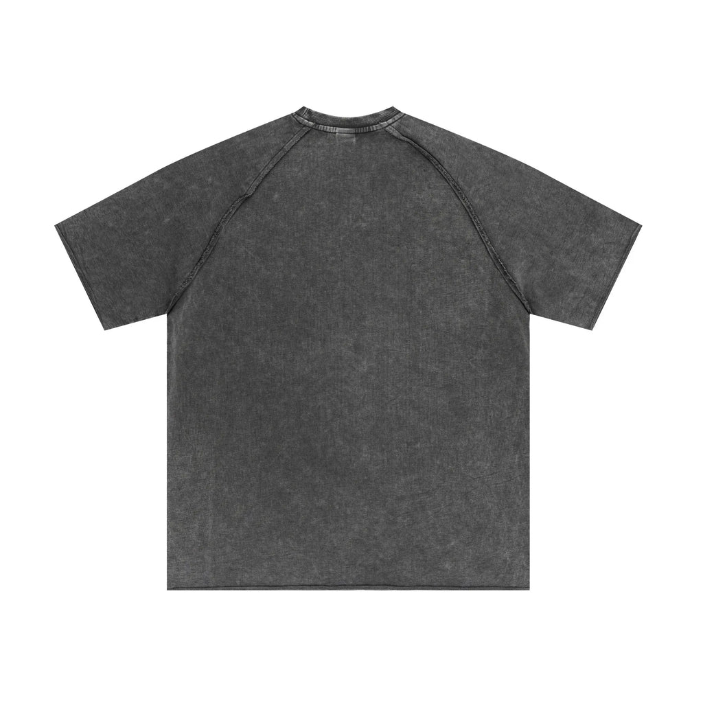 Back view of a plain dark gray t-shirt on a white background