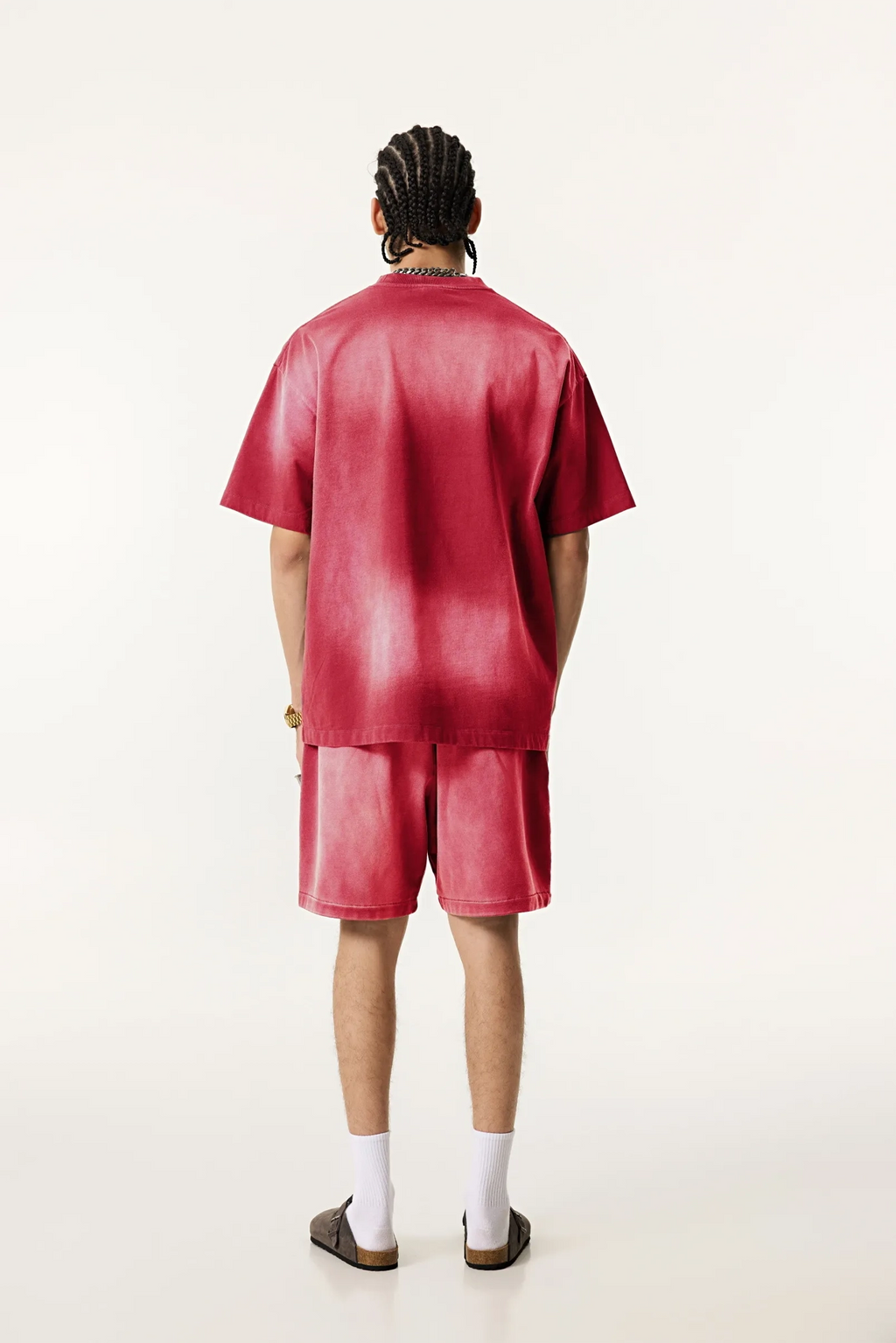 Person wearing a red outfit on a white background