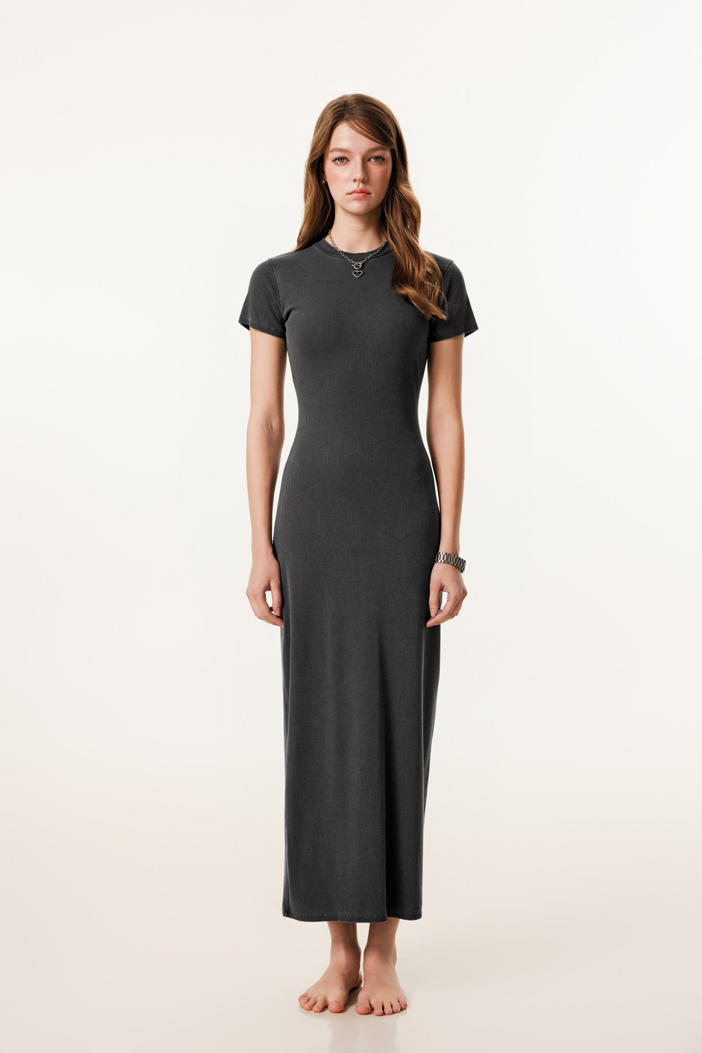 Woman wearing a black dress on a white background