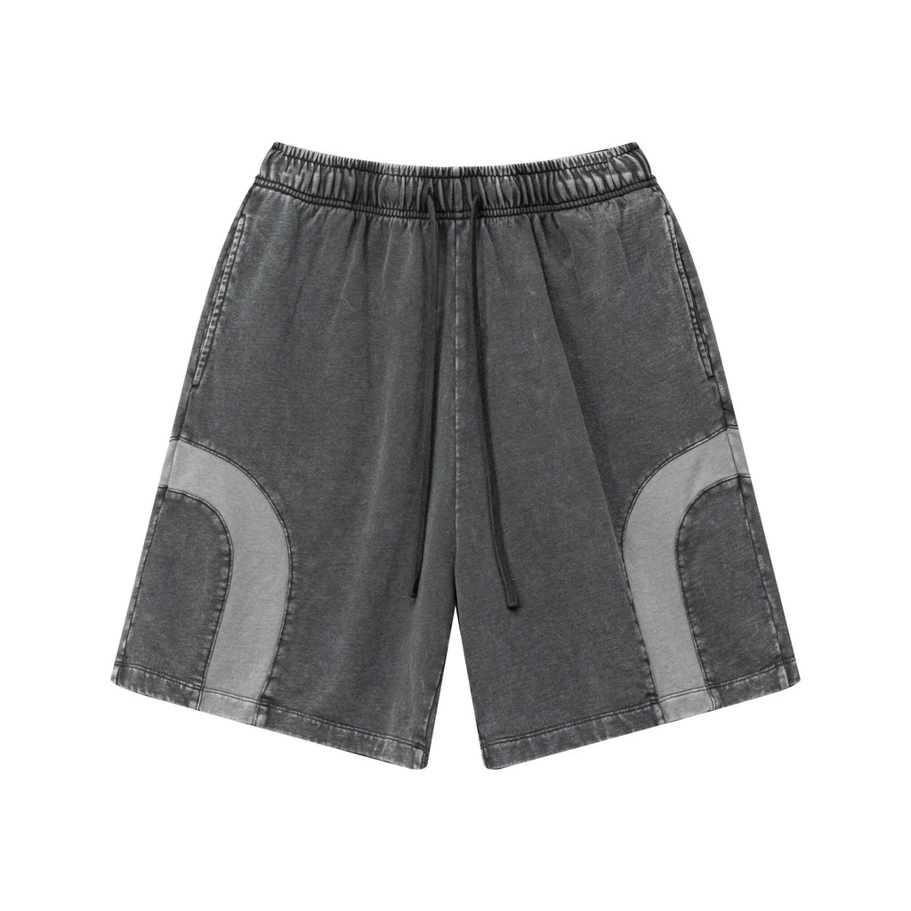 Gray shorts with patchwork design on a white background