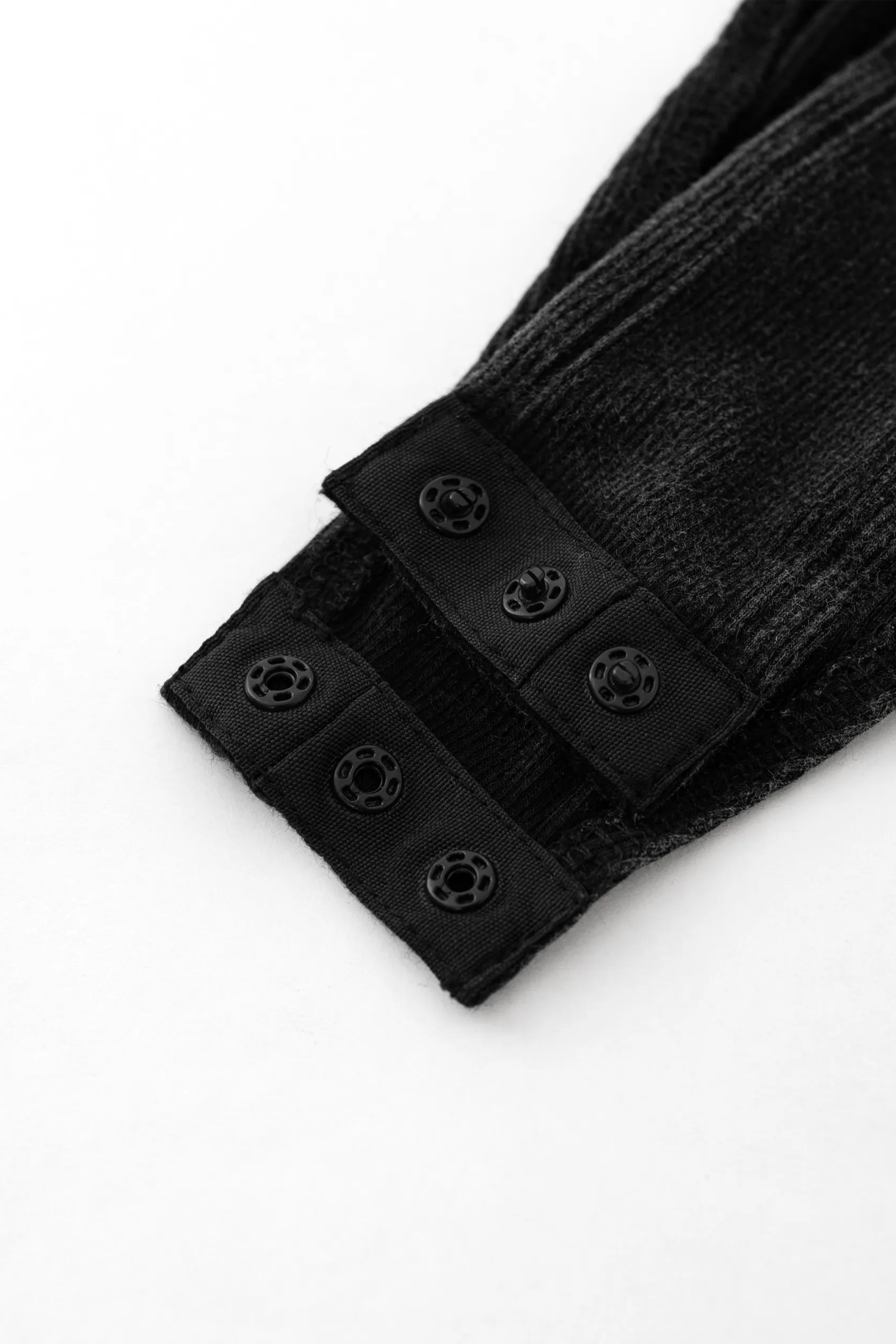 Black hair extensions with clips on a white background