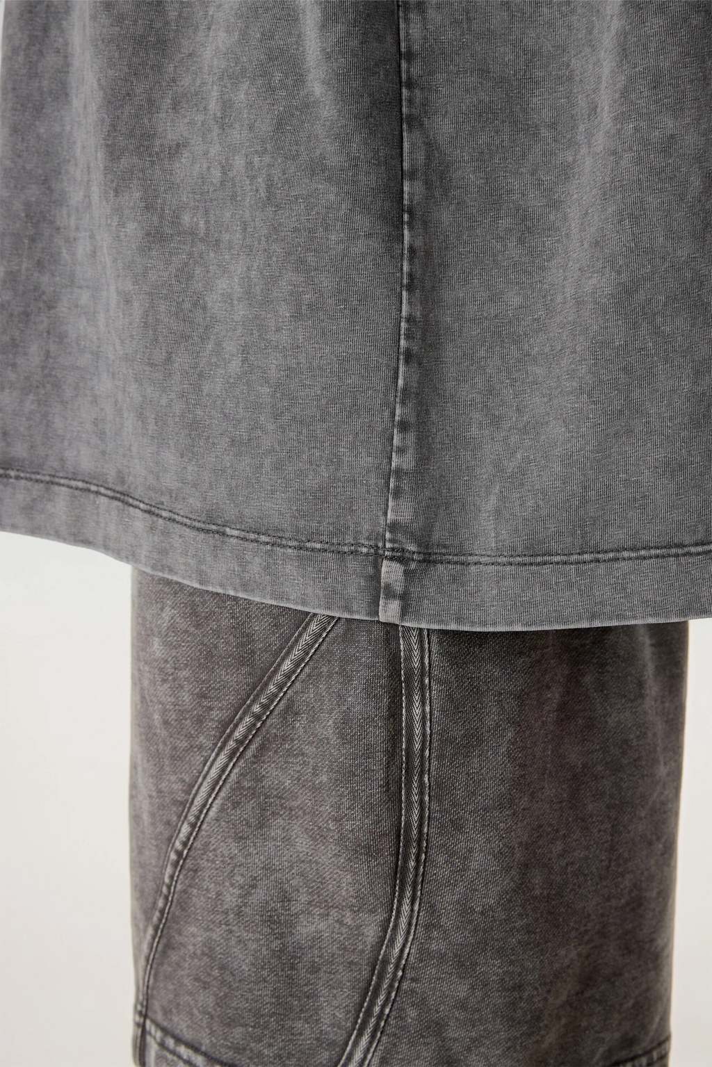 Close-up of a gray denim skirt on a white background