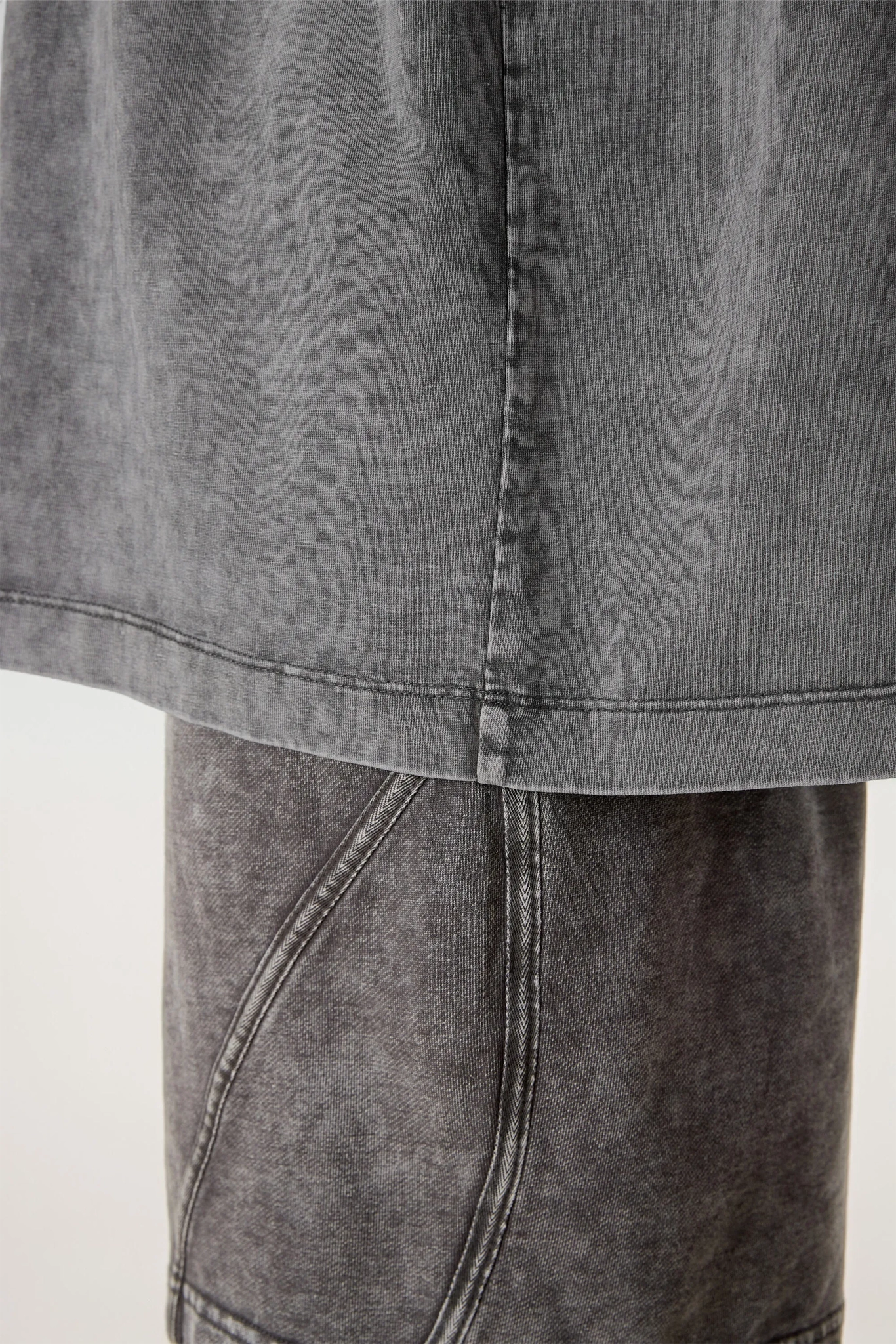 Close-up of a gray denim skirt on a white background