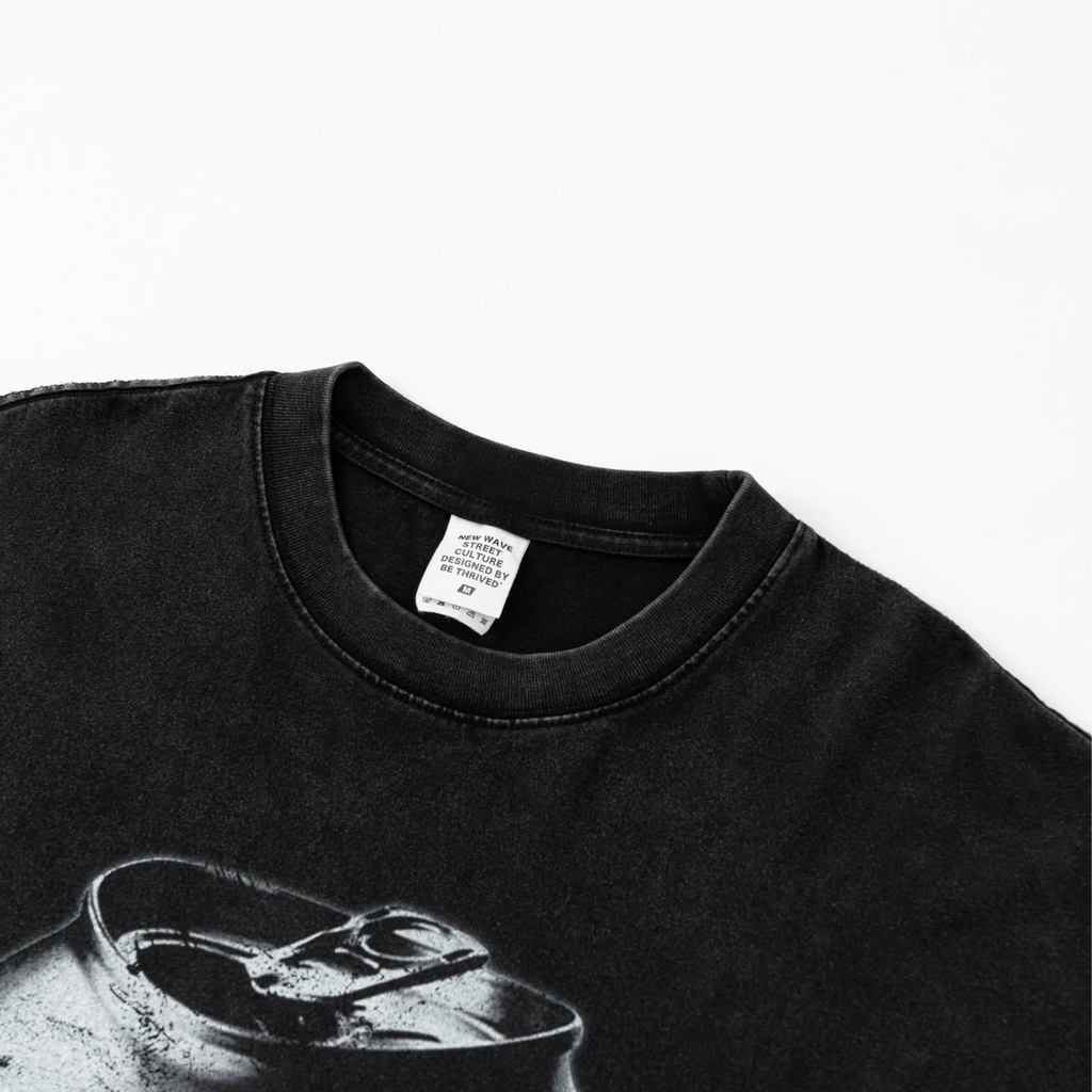 Black t-shirt with a graphic design on a white background