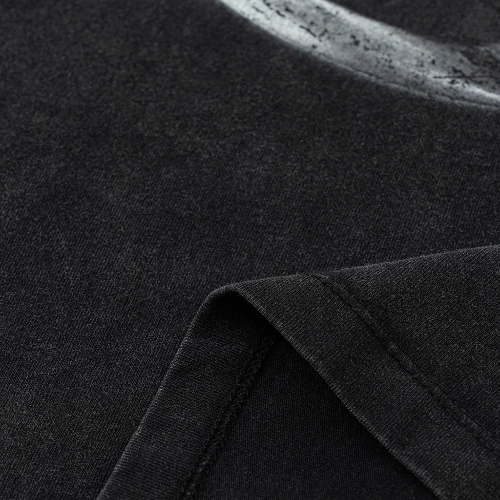 Close-up of dark fabric with a visible seam