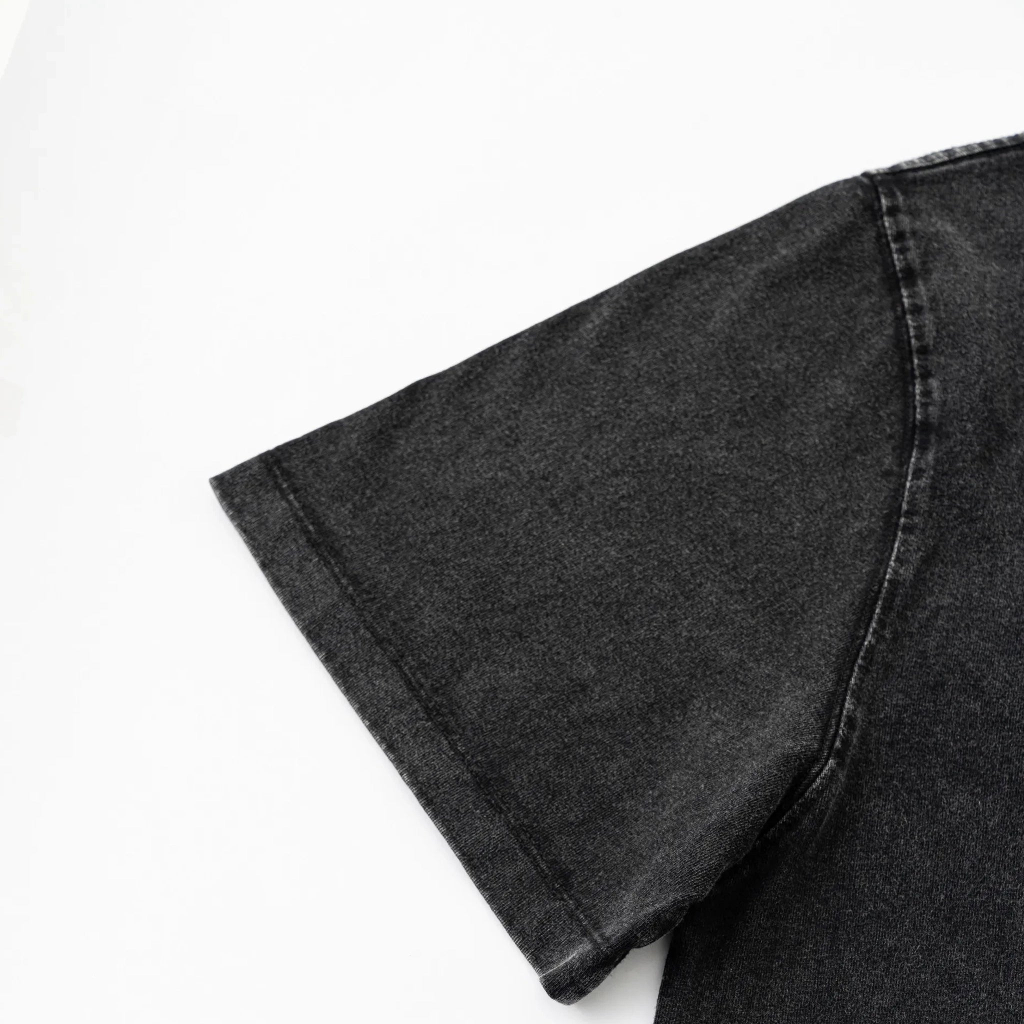 Black denim jeans on a white background