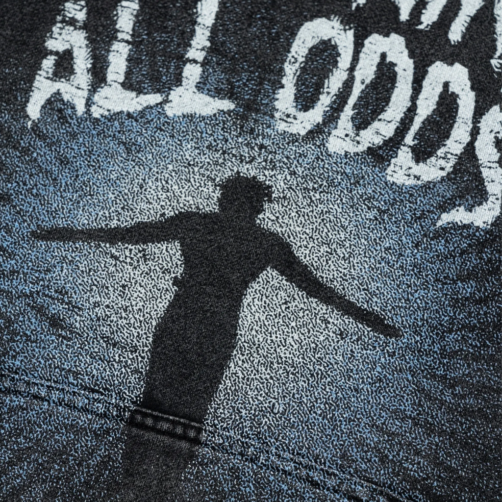 Person casting a shadow on a textured surface with 'ALL ODDS' text.
