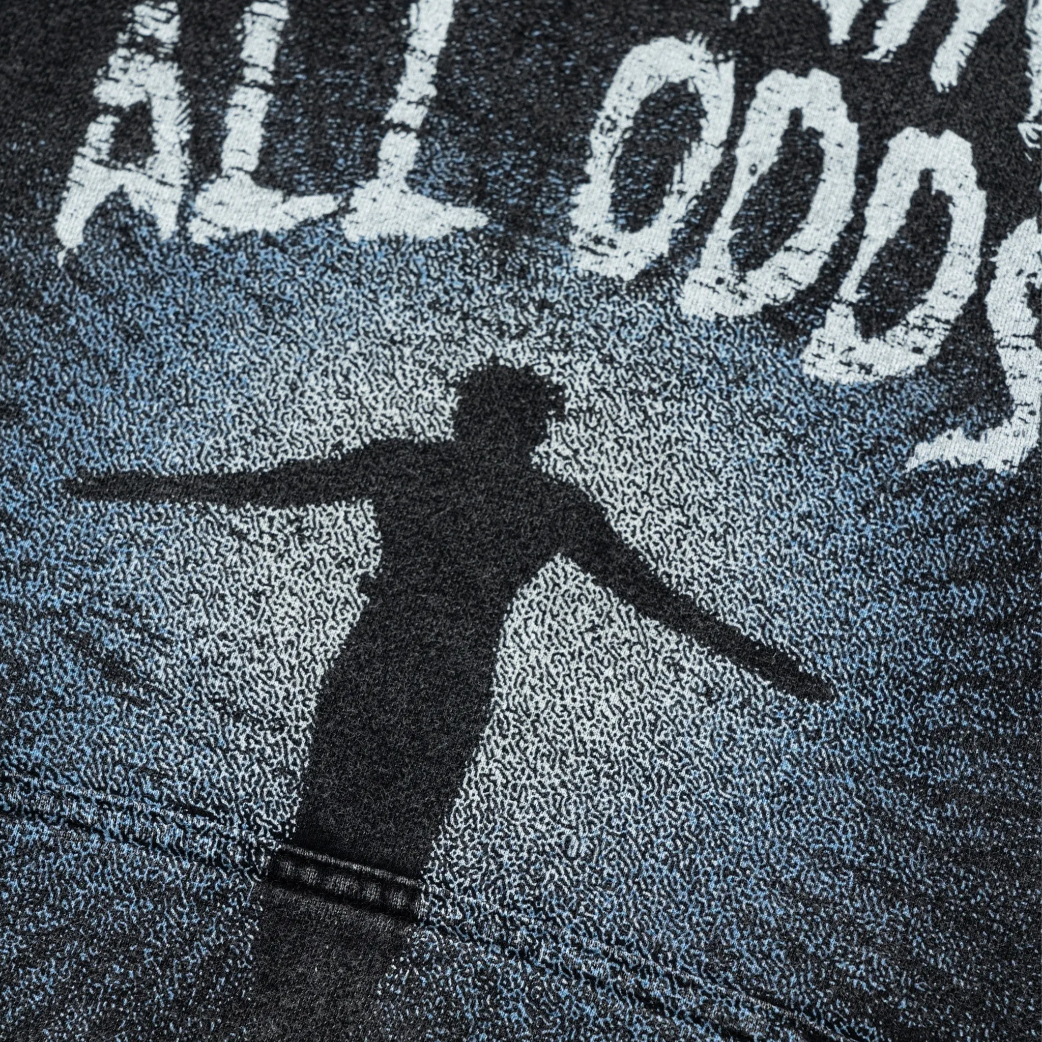 Person casting a shadow on a textured surface with 'ALL ODDS' text.