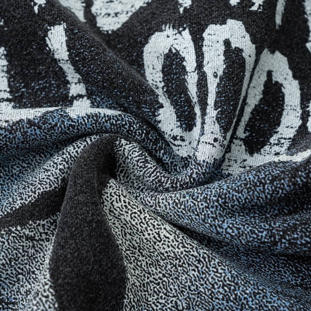 Close-up of textured fabric with abstract pattern