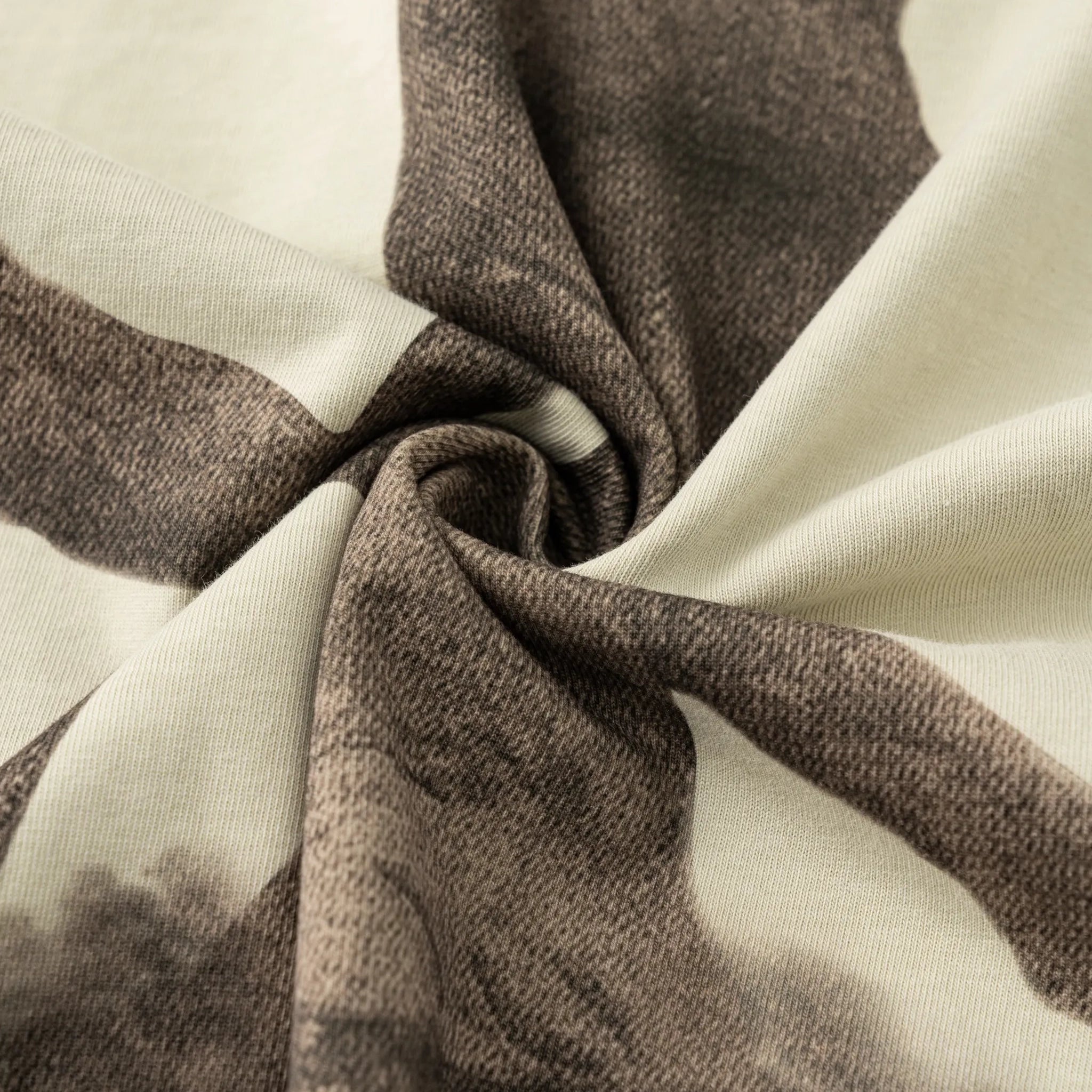 Close-up of brown and beige fabric with a textured pattern
