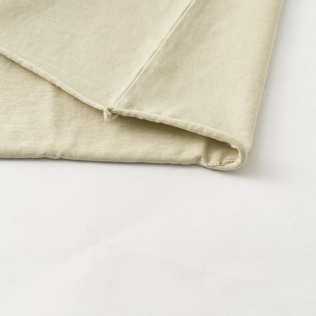 Beige fabric folded on a white background